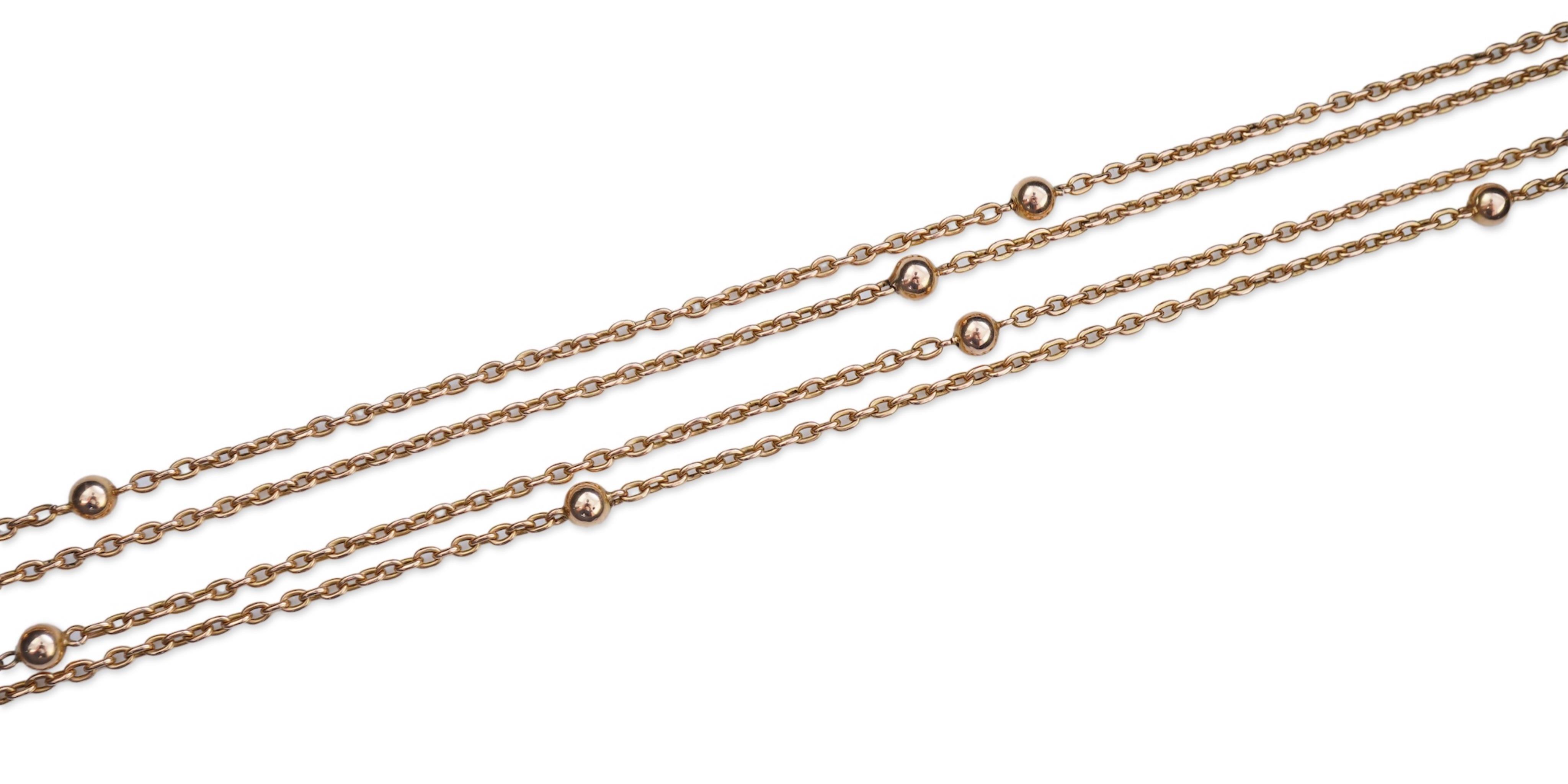 A gold long guard chain, early 20th century